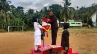 Kapolsek Ipda Teguh Baharijanto, Inspektur Upacara Penurunan Bendera Merah Putih HUT RI ke 80 di Pulau Sembilan Sukses